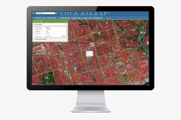 Canadian geocoding results plotted on a desktop monitor.