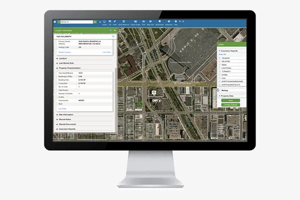 SmartParcels property record located by address and parcel number on a monitor.