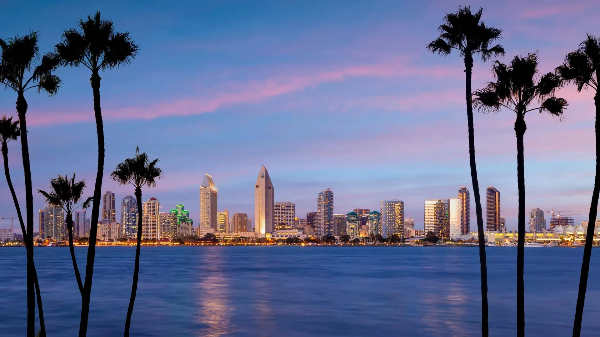 San Diego skyline with commercial office and waterfront buildings viewed from the harbor