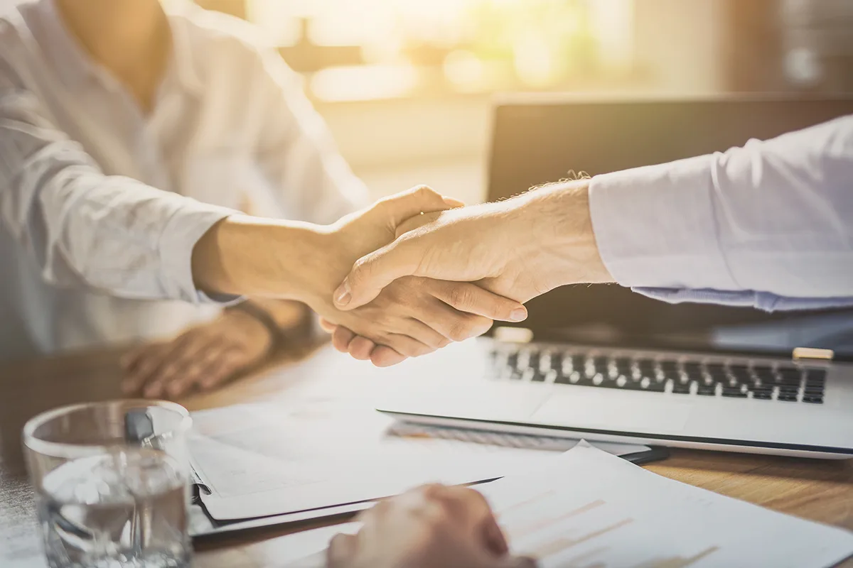 Business people shaking hands. Finishing up meeting.